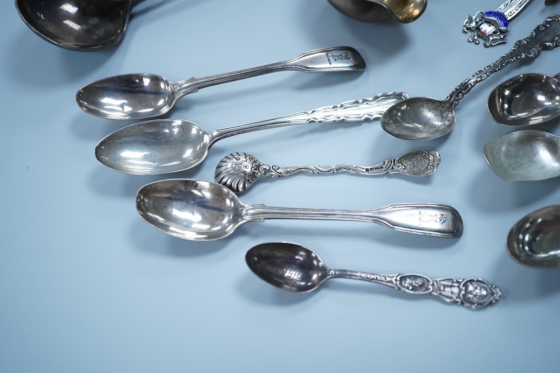 A small quantity of assorted 19th century and later silver and white metal flatware, including teaspoons, commemorative spoons, ladles, sugar tongs, pickle fork, a pair of Swedish salad serves, a similar butter knife and